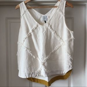 Heavy white tank with textured detailing